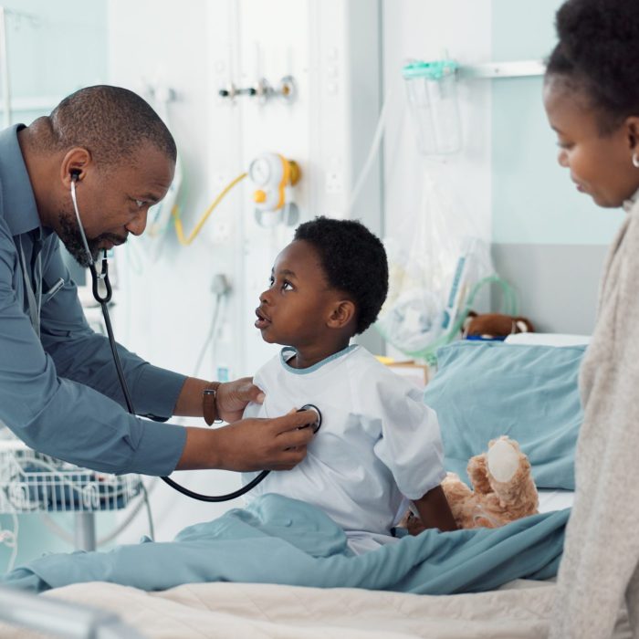 Pediatrician, African and parent with child in hospital for check or healthcare consultation in cli.